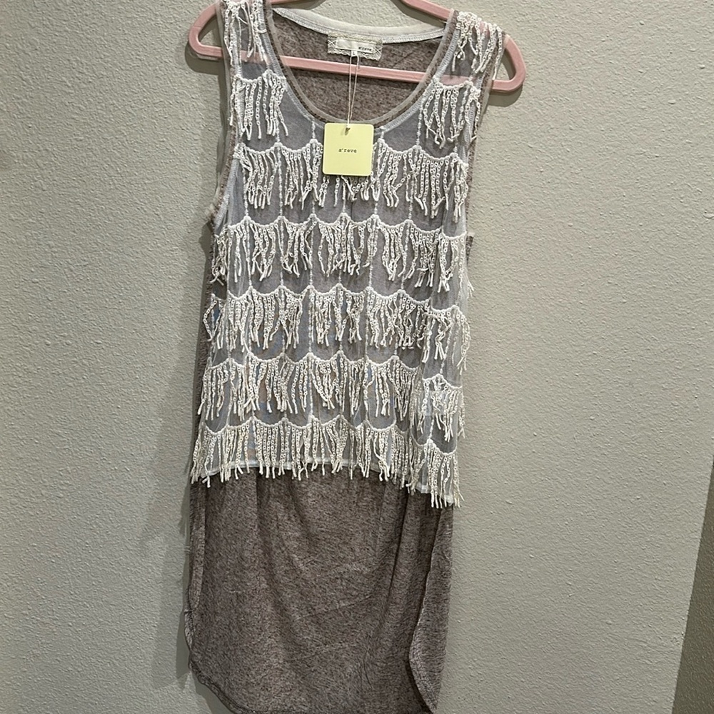 NWT this is a high/low tunic with fringe
